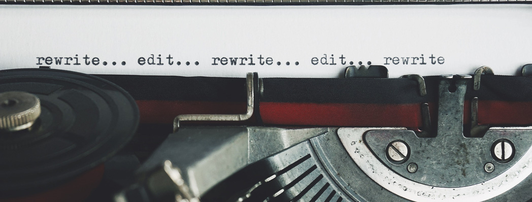 typewriter with words edit, rewrite